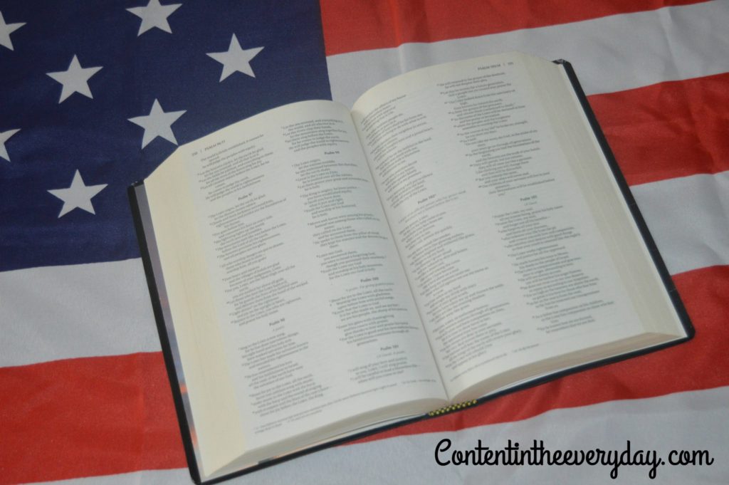 Bible laying on the American Flag