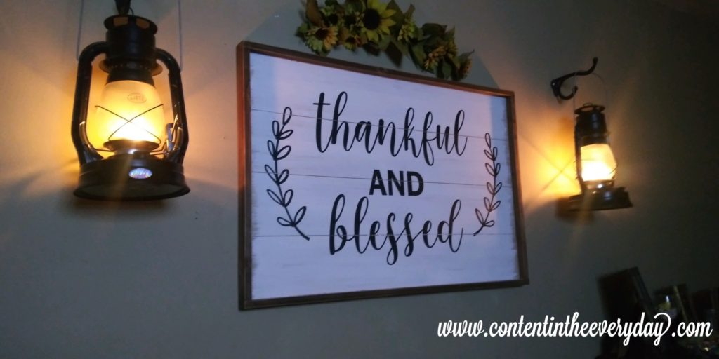 Thankful and Blessed sign with lighted Oil Lanterns