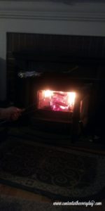 Roasting hotdogs in the inside fireplace