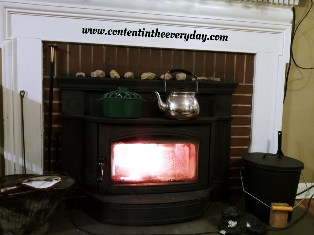 fireplace with tea kettle